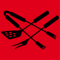 Meat fork and spatula placed in a cross, a design for cooking aprons and grilling sessions.