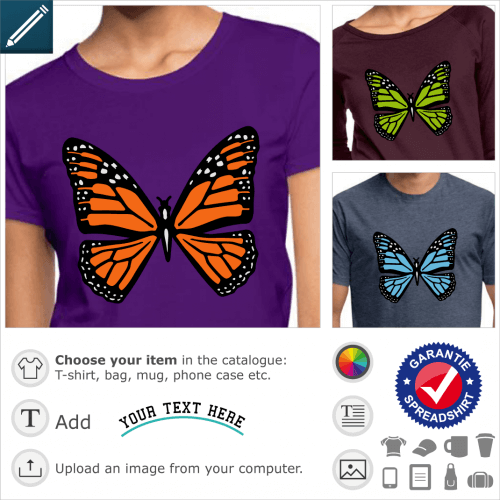 Graphic butterfly with orange motifs on black wings, dotted with small white dots like snow.